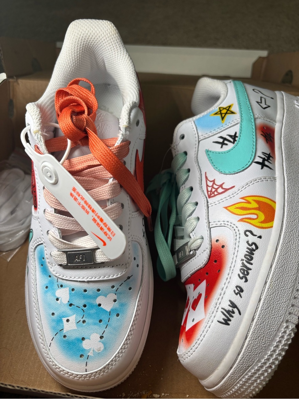 Nike Kids White Sneakers with Turquoise, Orange & Red Accents